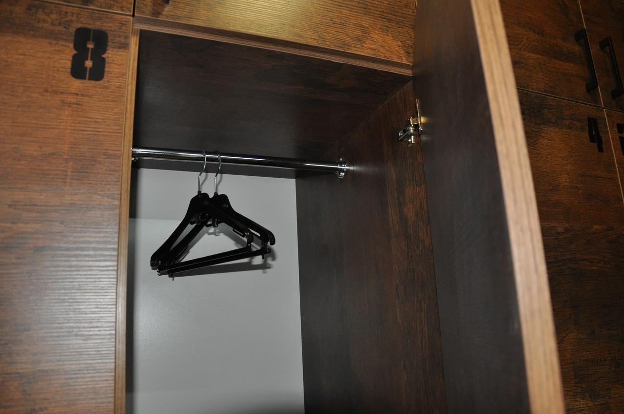 Full House Hotel&Capsule Hostel, Rivne Esterno foto A coat hanger in a wardrobe